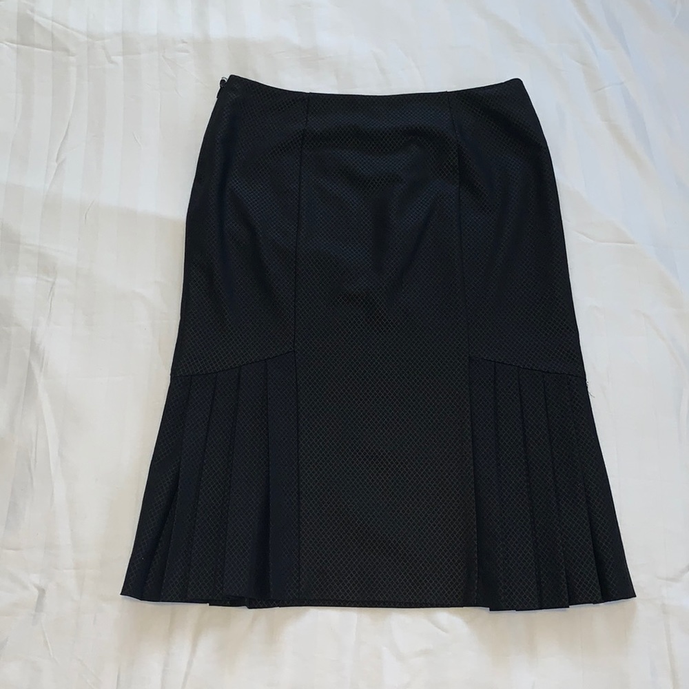 BeBe Skirt, Size 2. Good used condition. Pleaded on the sides. Runs big